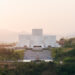 Sequence Of Curved White Marble Volumes Shape Serie Architects’ Ashram Auditorium In India